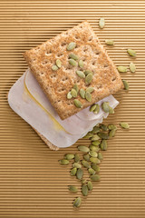 sandwich of ham and whole wheat bread with pipes