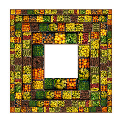 Fruit in a market is arranged to make a frame for text or art and is seen from above.