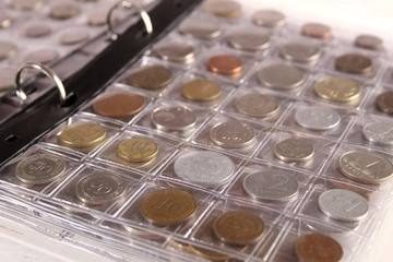 Many coins of different countries and times. Numismatics