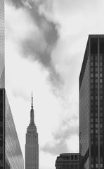 LOW ANGLE VIEW OF SKYSCRAPERS AGAINST CLOUDY SKY - 318694905