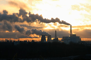 sunrise over a power plant