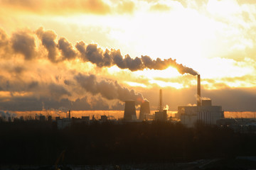 Fototapeta premium sunrise over a power plant
