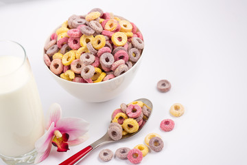 Fototapeta na wymiar Corn cereal breakfast flake in children cups and milk is a healthy breakfast that is good for your body every day on a white background.