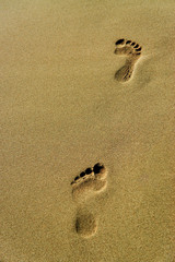 A footprints on the beach in Santo Tomas, Menorca - Spain