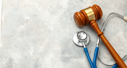 Judge gavel and stethoscope. The law in medicine, the sentence on medical negligence