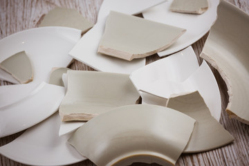 Broken Plate  on the floor in the kitchen The concept of accidents in the kitchen is dangerous for...