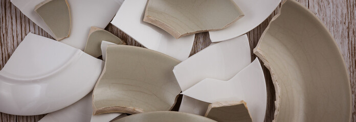 Broken Plate  on the floor in the kitchen The concept of accidents in the kitchen is dangerous for...