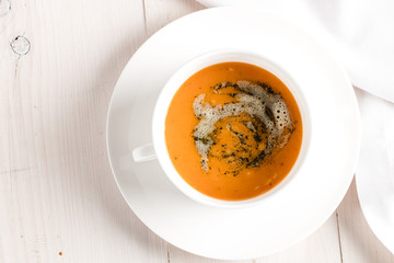 Winter spicy lentil cream soup on light airy background