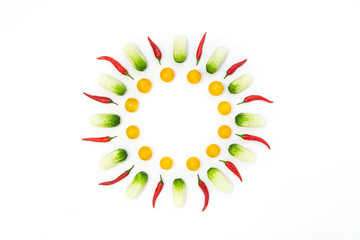 Top view flat lay over cucumbers, cherry tomatoes and peppers on a white background with copy space. Food template food design menu background with culinary ingredients.