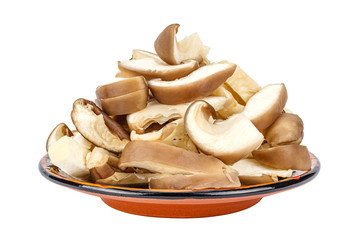 Chopped fresh oyster mushrooms on a brown ceramic saucer isolated on a white background. Pleurotus ostreatus mushroom