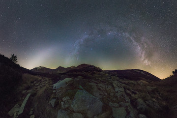 Obraz na płótnie Canvas Zodiacal Light and Milky Way Over Mountain Landscape