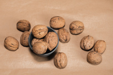 walnuts in the shell on wooden background