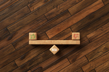 wooden blocks formed as a seesaw with thumbs up and down icons on wooden background