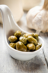 Pickled green capers close-up