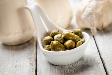 Pickled green capers close-up