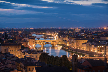 Fototapeta na wymiar Florence panoramic view from above during blue hour with historical buildings Duomo churches and Ponte Vecchio