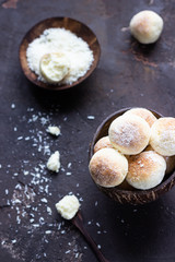 Cookies with coconut flakes, dark brown concrete background. Coconut macaroon.