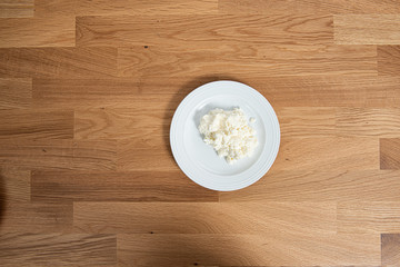 Plate of mozzarella on a wooden table.