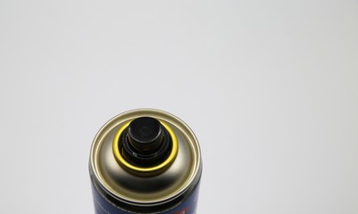 Close up of top spray can with valve cap, white blank background