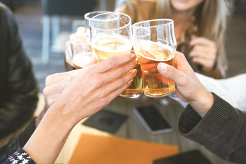 Hands holding glasses of beer and cheering with each other- Lifestyle concept