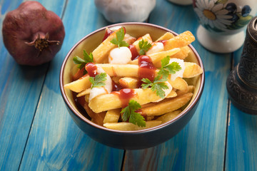 Canadian poutine potato fries with cheese and gravy