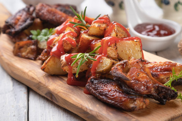Roasted potato with chicken wings
