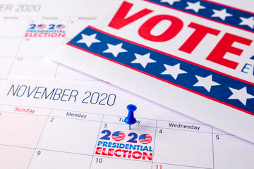 Fototapeta na wymiar November 2020 presidential election text on calendar concept. To illustrate voting and political campaign in the united states of america this year. Red white and blue colors and the american flag.