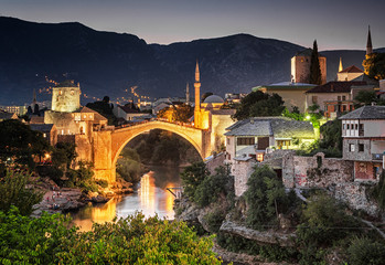 Fototapeta premium Colorful sunset over the medieval bridge of Mostar