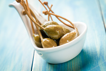 Pickled green capers close-up