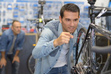 repair specialist fixing a bike