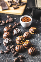 Praline bonbons. Chocolate truffles and cocoa powder.