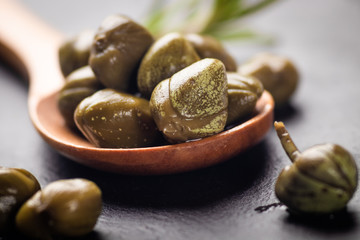 Pickled green capers close-up