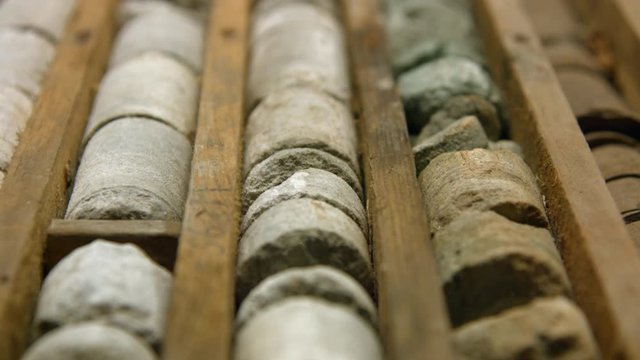 Drill core samples from geological borehole in wooden box