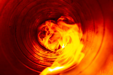 smoke and fire inside the air duct in the ventilation system, the front and back background is...