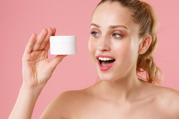 Close up blonde half naked woman 20s perfect skin nude makeup blue eyes isolated on pastel pink...