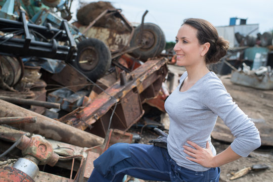 Female Junkyard Worker Smiling