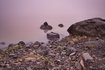 Obraz premium Rocks lying in the still waters of Iceland