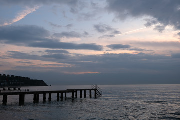 pier sea and clouds sunset