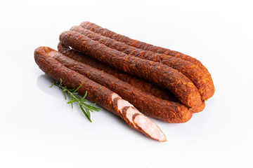 Smoked sausage. Traditional meat product isolated on white.