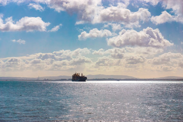 Cargo container Ship arriving into River Tagus Lisbon Port, Portugal