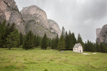 An isolated little chapel (St. Silvester) among the woods in the Italian Dolomites