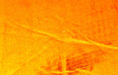 Textured abstract background with a bright orange pattern of vintage old paper.