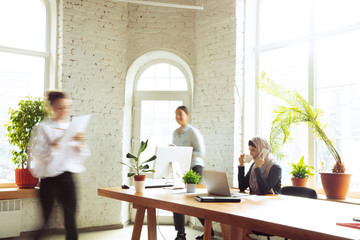Concentrated. Portrait of a beautiful arabian businesswoman wearing hijab while working at...