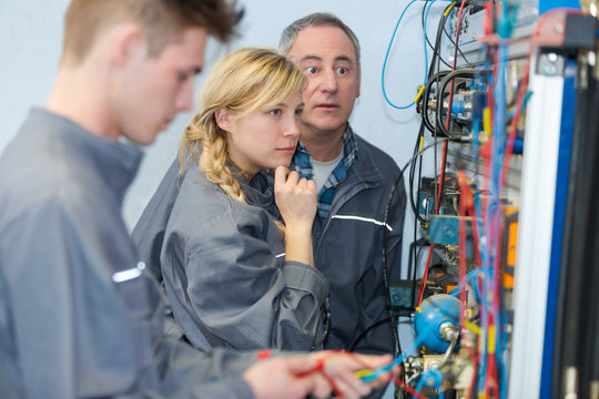 apprentices working in a data center - Powered by Adobe