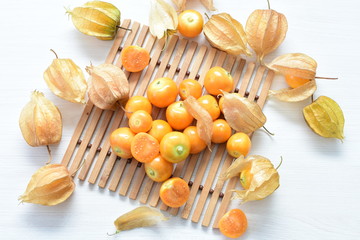 natural cape gooseberry on wooden background