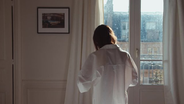 Young girl wearing a white shirt at home