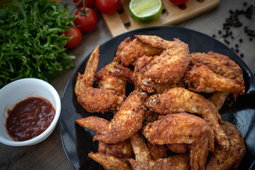 Hot Meat Dishes - Fried Chicken Wings on plate with salad