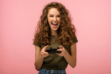 Closeup studio portrait of pretty gamer girl with gamepad - obrazy, fototapety, plakaty