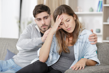 a man consoling upset woman