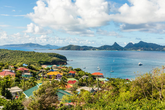 Residential houses at the bay, Mayreau island panorama with Union island in the background, Saint Vincent and the Grenadines